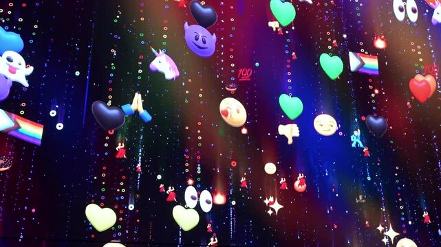 Colourful emoji artwork displayed outside Tottenham Court Road Station, featuring a playful grid of expressive faces and symbols.