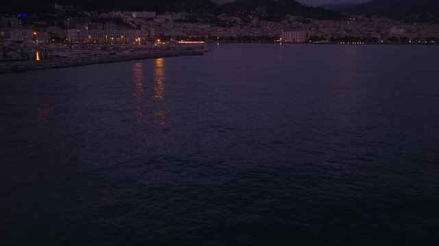 Flying Over The Sea At Dusk With Centro Storico In Salerno City, Italy. - aerial shot