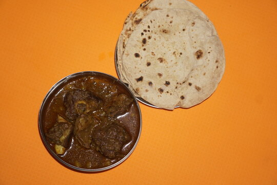 Delicious Mutton Curry, also called Ahuna or Handi Meat, rich in spices and flavors, perfectly served with soft roti or chapati