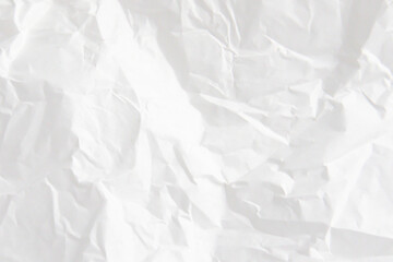 Fototapeta premium White crumpled paper texture as background. Crushed paper texture, rough creased grunge surface