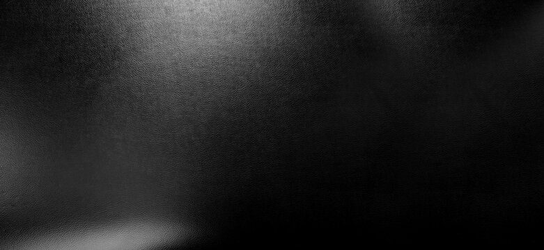 Premium black pebbled leather texture featuring sophisticated matte finish with elegant highlights. Ideal for luxury backgrounds fashion design and high-end product mockups
