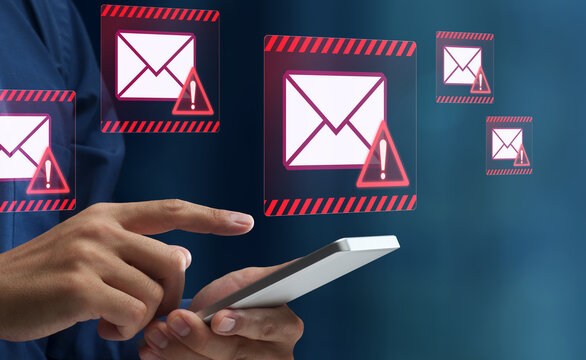 Spam email. Phishing and scam mails. Smartphone and warning triangle icons. Man tapping smartphone screen.