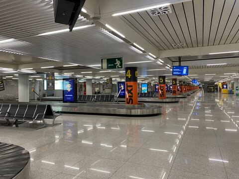 Palma, spain, january 20, 2026, empty airport baggage claim area with conveyor belts and sixt branding anticipating passenger arrivals