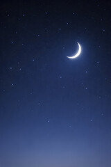 Fototapeta premium Minimalist night sky background with a glowing crescent moon and scattered stars, soft blue gradient atmosphere, calm and peaceful mood, clean composition with copy space, no people, no text, no logos