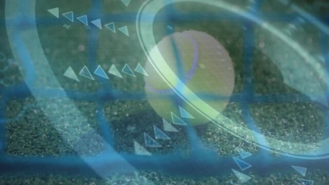 Tennis ball being animated on green court, showcasing augmented reality rings and arrow graphics
