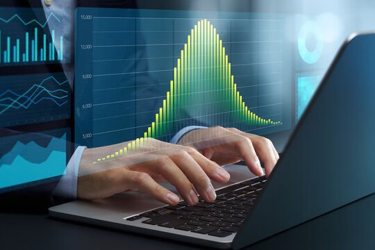 Data analysis based on normal distribution. Statistical modeling and probability distributions. Businessman using laptop computer to analyze business data.