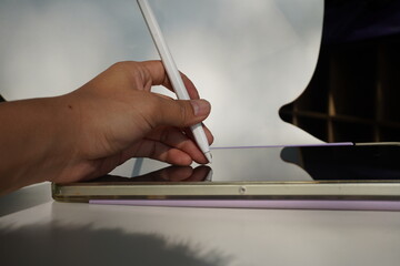 Laptop and computer mouse on a clean desk, home office or remote work concept.