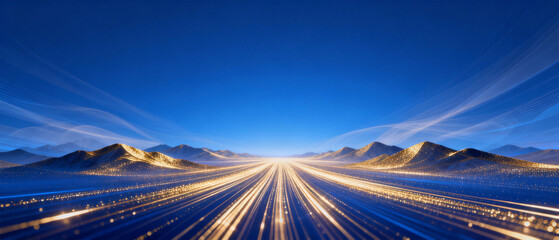 A panoramic view of a desert highway at night with light trails from vehicles stretching toward distant mountains under a clear blue sky.