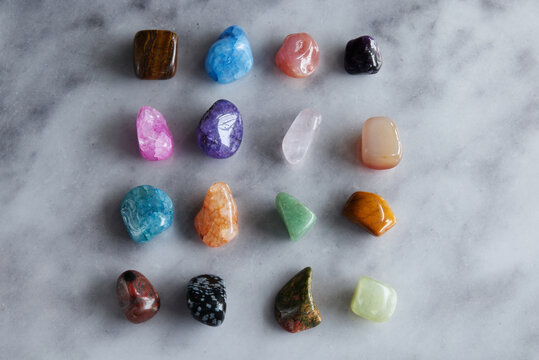 Colorful Polished Gemstones Collection on Marble Background, Flat Lay
