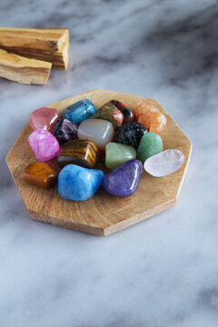 Colorful Healing Crystals Collection on Wooden Plate, Flat Lay