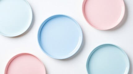 Pastel plates arranged on white background for food blog