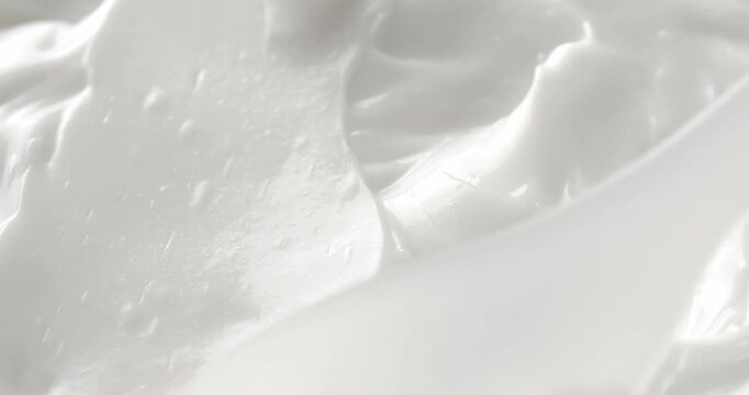 Smear of moisturizing cream made with a cosmetic spatula, close-up footage, cream texture.