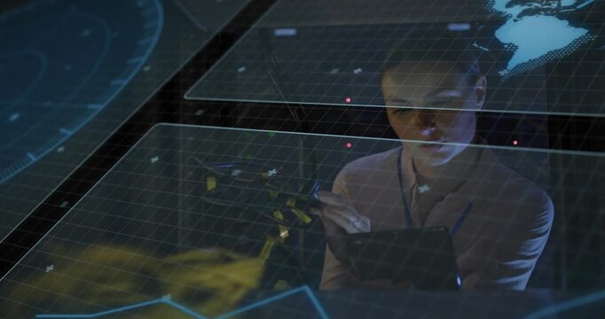 Data analyst reaching and tapping hologram grid, checking tablet, refining globe, yellow data model