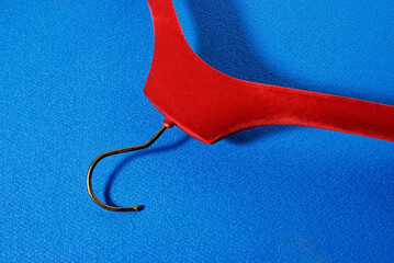 red hanger on blue background