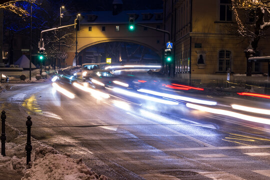 night city traffic with light trails at urban intersection