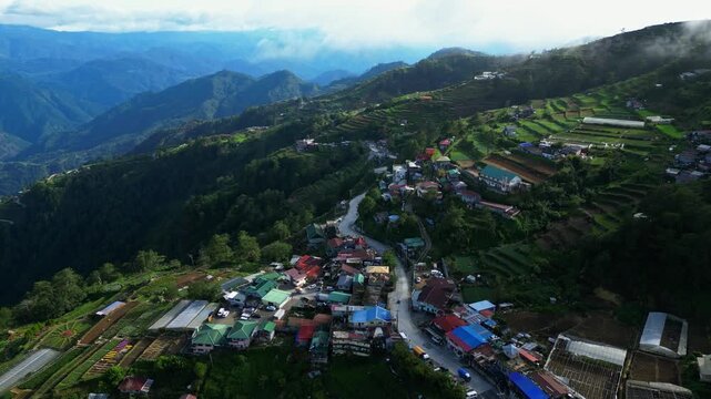 Top down aerial view of Atok Benguet Philippines showing zigzag highway patterns and organized vegetable fields