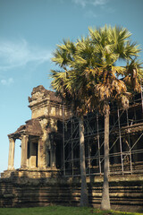 Naklejka premium Angkor Wat Gallery Restoration With Palm Trees, Siem Reap, Cambodia