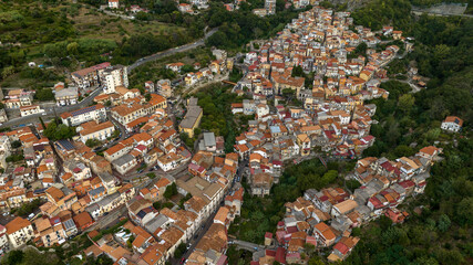 Fototapeta premium Aerial view of the historic center of the town of Lamezia Terme, in the province of Catanzaro, Calabria, Italy. These are the old houses of the Nicastro district, perched on the hill.