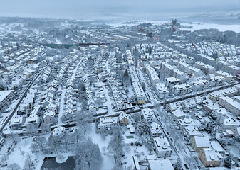 Aerial photo of a snowy area with residential buldings in the city of Kornwestheim in Baden-Wuerttemberg, Germany
