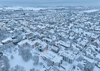 Aerial photo of a snowy area with residential buldings in the city of Kornwestheim in Baden-Wuerttemberg, Germany
