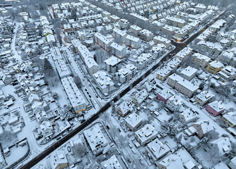 Aerial photo of a snowy area with residential buldings in the city of Kornwestheim in Baden-Wuerttemberg, Germany

