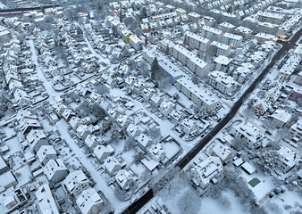 Aerial photo of a snowy area with residential buldings in the city of Kornwestheim in Baden-Wuerttemberg, Germany
