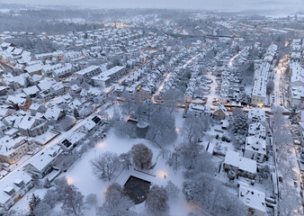 Aerial photo of a snowy area with residential buldings in the city of Kornwestheim in Baden-Wuerttemberg, Germany
