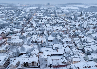 Aerial photo of a snowy area with residential buldings in the city of Kornwestheim in Baden-Wuerttemberg, Germany

