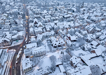 Aerial photo of a snowy area with residential buldings, shpping center and administrative buildings in the city of Kornwestheim in Baden-Wuerttemberg, Germany

