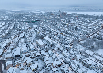 Aerial photo of a snowy area with residential buldings in the city of Kornwestheim in Baden-Wuerttemberg, Germany
