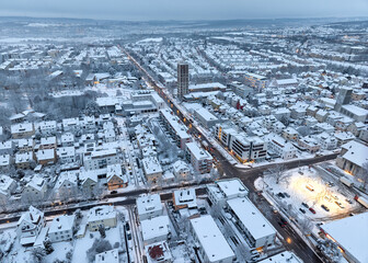 Aerial photo of a snowy area with residential buldings, shpping center and administrative buildings in the city of Kornwestheim in Baden-Wuerttemberg, Germany

