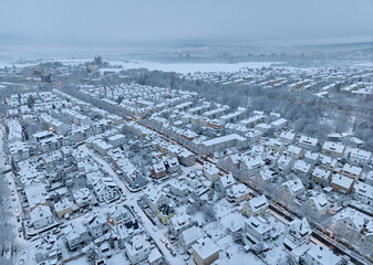 Aerial photo of a snowy area with residential buldings in the city of Kornwestheim in Baden-Wuerttemberg, Germany
