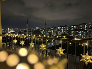 Ramadan City Night View with Golden Star Decorations - Islamic Holy Month Urban Celebration Lights