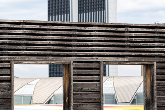 Modern urban architecture building facade with wood pattern and window detail showing minimal geometry and clean contemporary structure