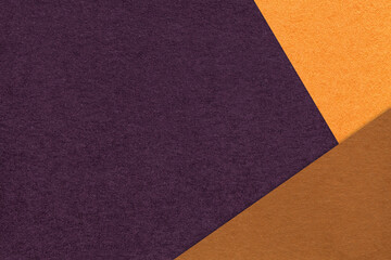 Fototapeta premium Dark purple textured paper background with orange brown triangular corners and copy space. Template for presentation, banner