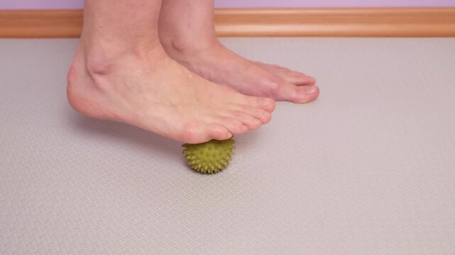 Set of exercises for the feet. Exercise 4: Roll a massage ball over your foot. Self massage exercise rolling a massage ball under the foot to relieve tension and stimulate reflex zones.