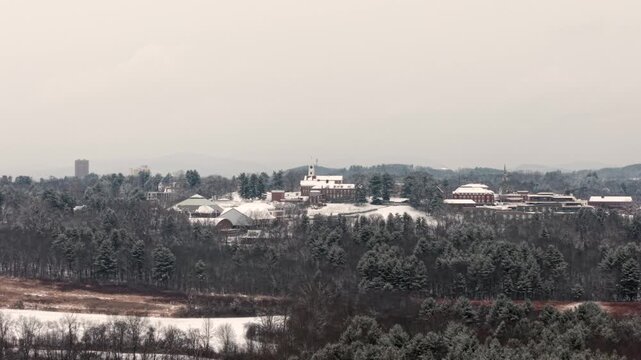 Distant drone shot of the liberal arts Amherst College education center in winter, Northampton, Massachusetts, USA