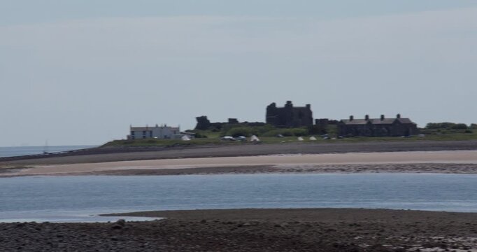 Extra wide panning shot of Pile Island and castel at roa island, near barrow in furness,