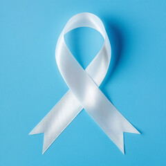 White ribbon of awareness on a blue background.