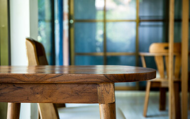 Wooden table in warm interior with blurred background. Perfect copy space for product display, mockup, lifestyle, interior design, and advertising concepts