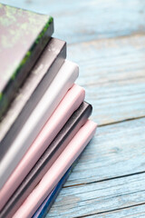 Stacked Photo Canvases with Textured Edges on Blue Wood