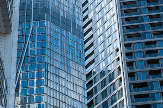 Modern glass facade lines in office architecture skyscraper detail from Frankfurt Germany showing corporate highrise texture closeup
