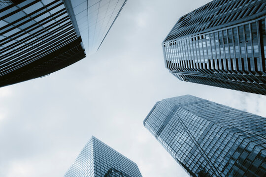 Modern urban glass architecture skyscraper office with upward geometry view in Frankfurt Germany business district highrise exterior