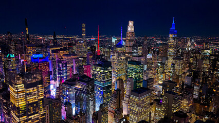 New York City skyline at night lights. Night aerial panorama of New York City skyline with glowing lights. © Vadim