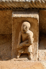 Romanesque corbel with human figure in El Salvador Church Pozancos Palencia © Agustin