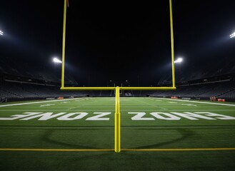 American football field goalposts illuminated at night, stadium lights shining on the green turf