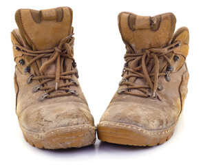 Old dirty work boots isolated on white background