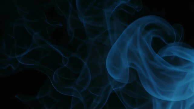 Ethereal blue smoke swirling on black background