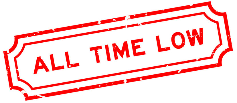 Grunge red all time low word rubber seal stamp on white background