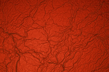 Red textured surface looking like soft paper